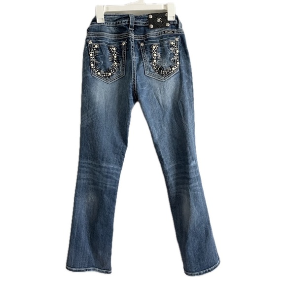 Miss Me Mid-Rise Boot Cut Denim Jeans with Rhinestone & Pearl Horse Shoe Pockets - Picture 1 of 9
